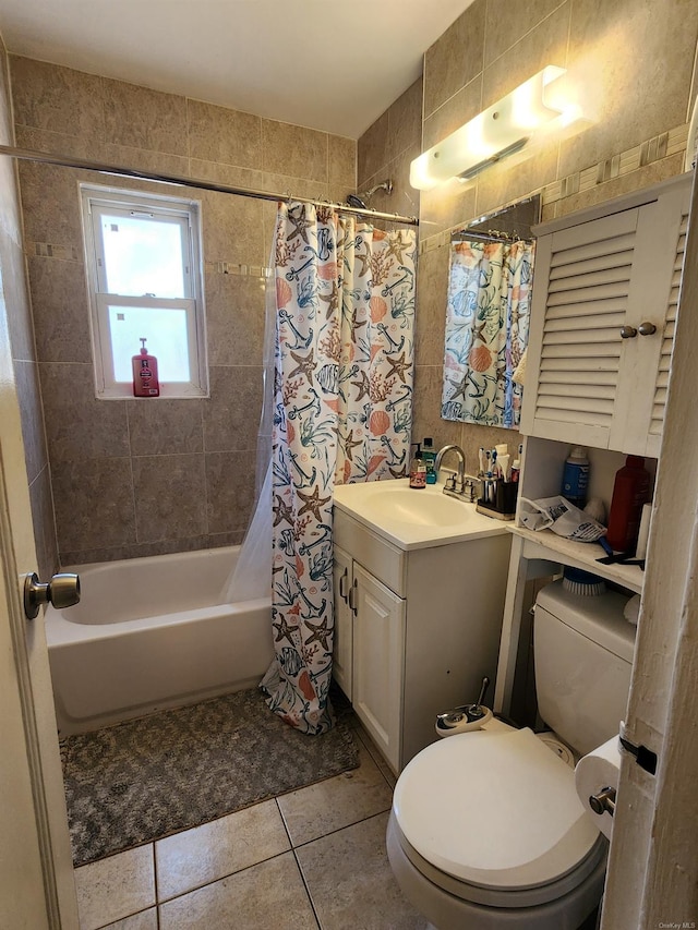 full bathroom featuring vanity, toilet, tile patterned flooring, and shower / tub combo