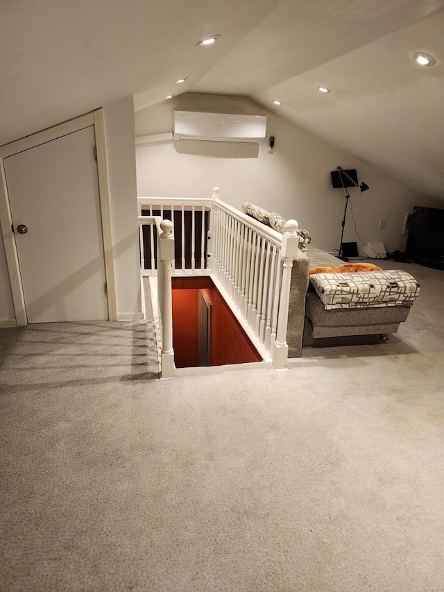 bonus room with vaulted ceiling, carpet flooring, and a wall mounted AC