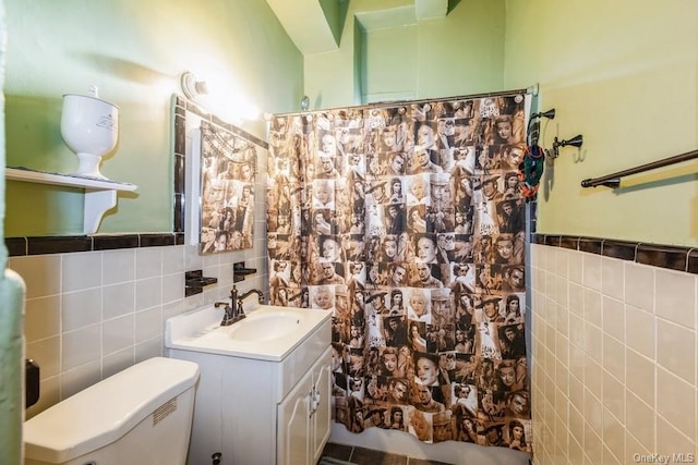 bathroom featuring a shower with curtain, toilet, and tile walls