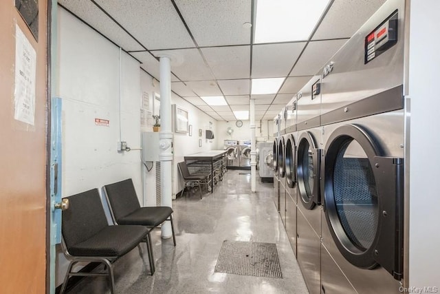 clothes washing area featuring washer and clothes dryer