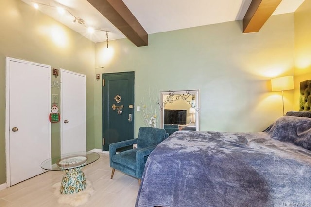 bedroom featuring beam ceiling