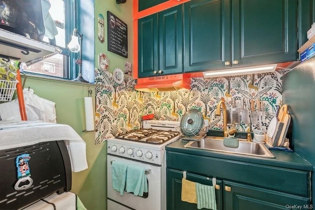 kitchen featuring sink, white gas stove, and decorative backsplash