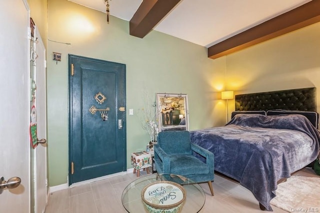 bedroom featuring beamed ceiling