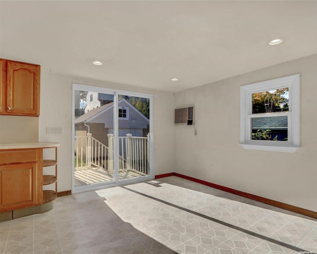 unfurnished living room with light tile patterned floors