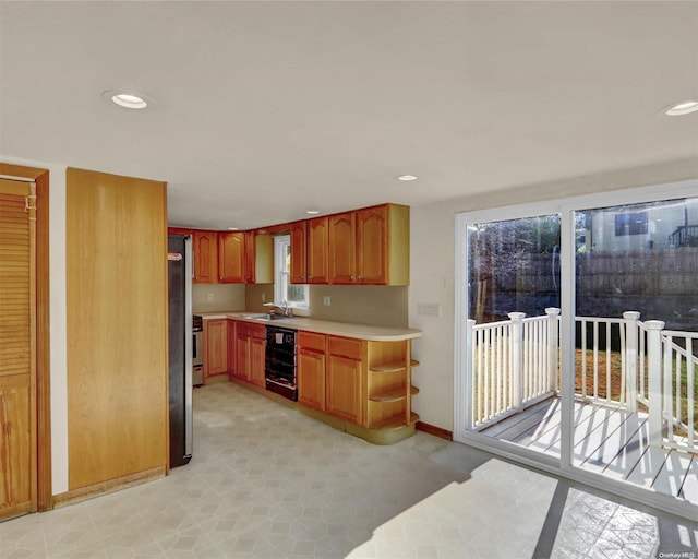 kitchen featuring stainless steel range, wine cooler, and sink