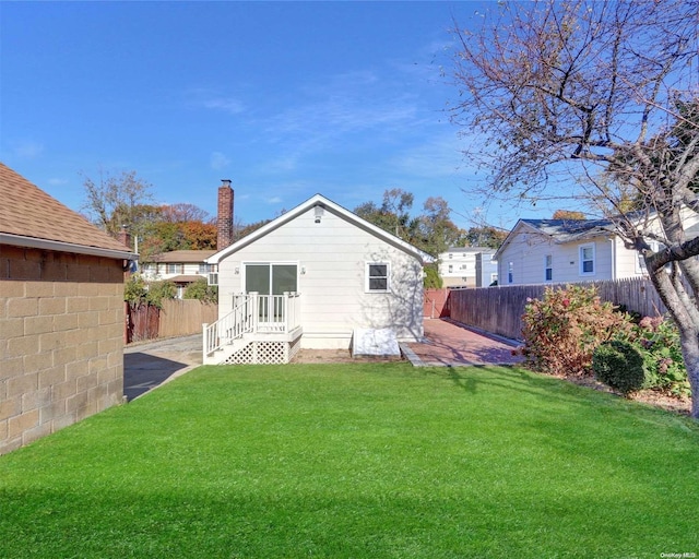 rear view of house with a lawn