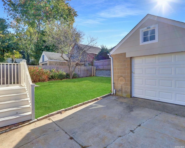 garage featuring a lawn