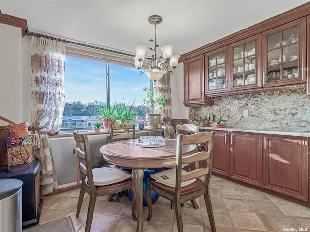 dining space featuring a chandelier