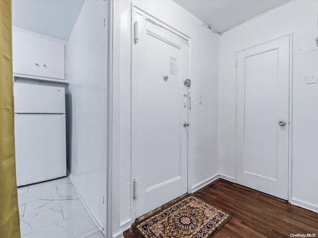 doorway featuring hardwood / wood-style flooring