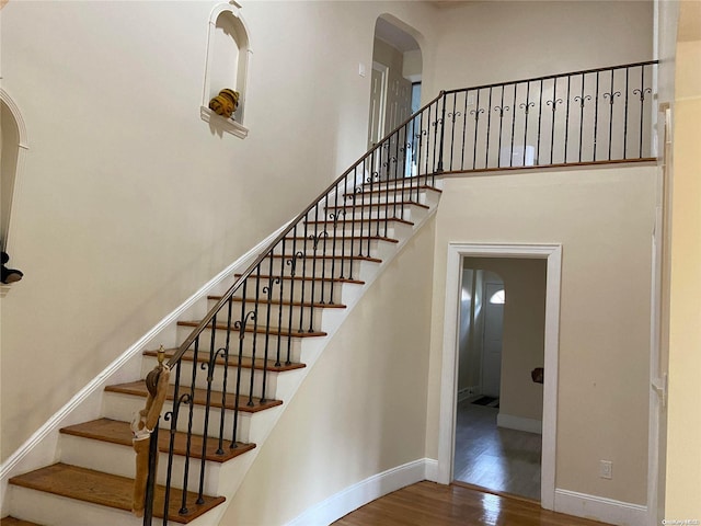 stairway featuring hardwood / wood-style flooring