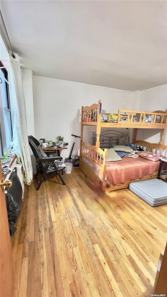 bedroom with wood-type flooring