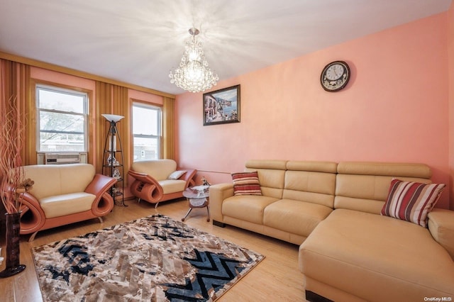 living room featuring light hardwood / wood-style flooring and an inviting chandelier