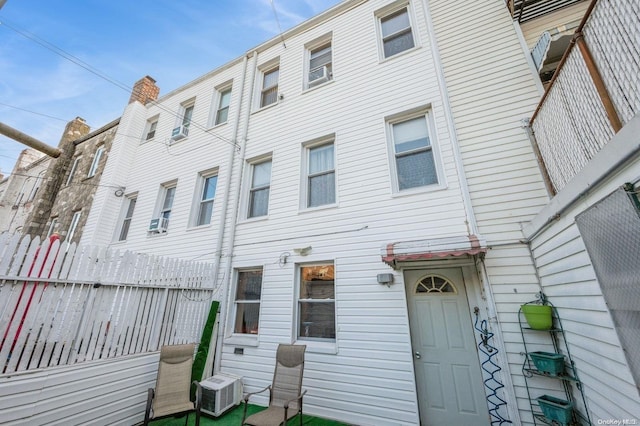 back of property with central AC unit