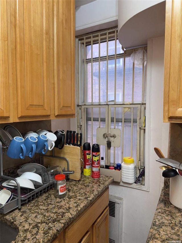 kitchen featuring dark stone counters