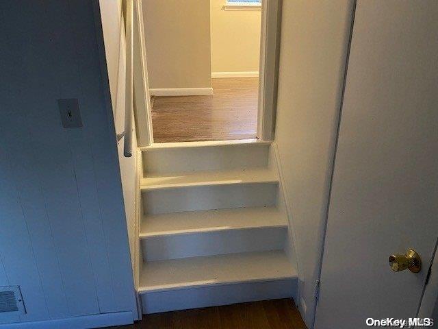 stairs with wood-type flooring