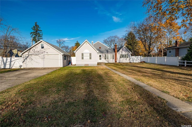 view of front of house with a garage and a front lawn