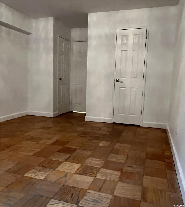 empty room with dark parquet floors