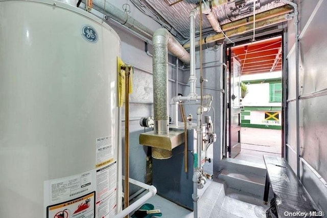 utility room with gas water heater