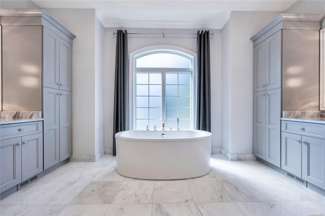 bathroom featuring a bathtub and ornamental molding