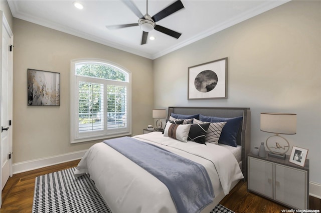 bedroom with ceiling fan, dark hardwood / wood-style flooring, and ornamental molding