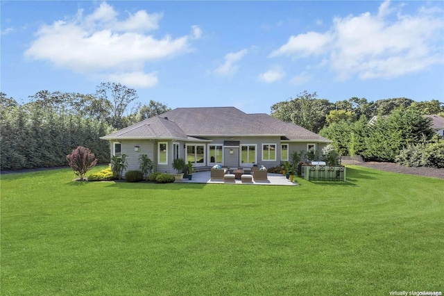 back of house with an outdoor hangout area, a yard, and a patio