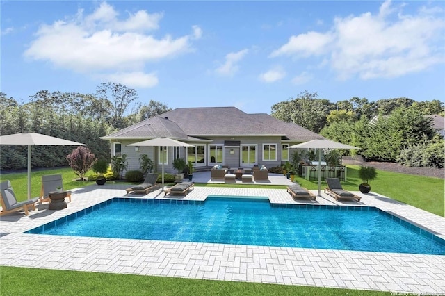 view of pool featuring an outdoor hangout area, a patio, and a yard