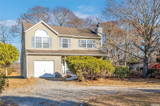 1400 Aldrich Ln, Laurel, NY 11948 - view of front of property with a chimney, driveway, and an attached garage