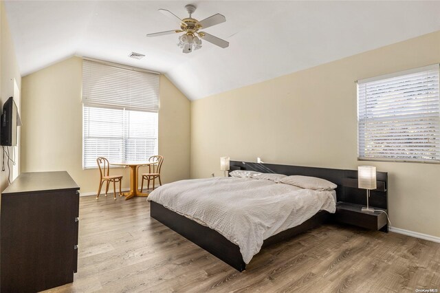 1400 Aldrich Ln, Laurel, NY 11948 - bedroom featuring wood finished floors, baseboards, vaulted ceiling, and ceiling fan
