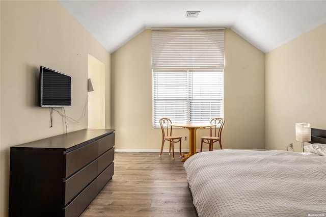 1400 Aldrich Ln, Laurel, NY 11948 - bedroom featuring wood finished floors and lofted ceiling