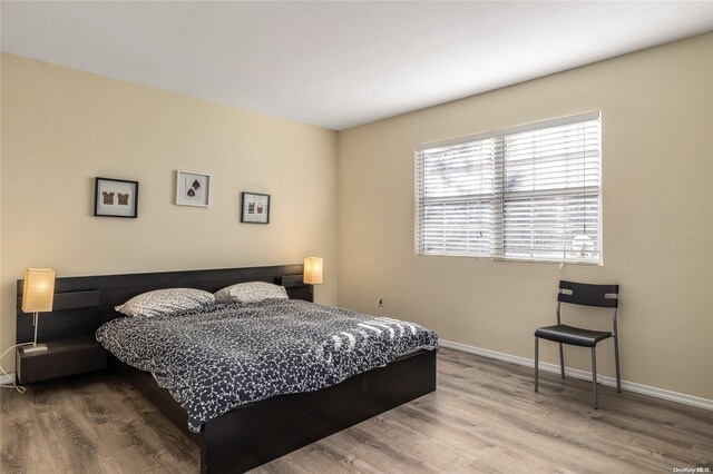1400 Aldrich Ln, Laurel, NY 11948 - bedroom with wood finished floors and baseboards
