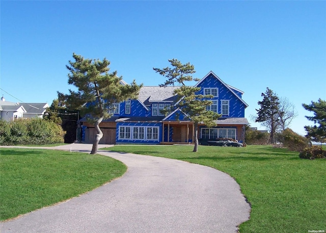 view of front of home with a front yard