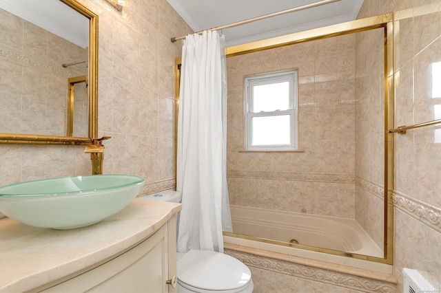 full bathroom featuring vanity, shower / bathtub combination with curtain, toilet, and tile walls