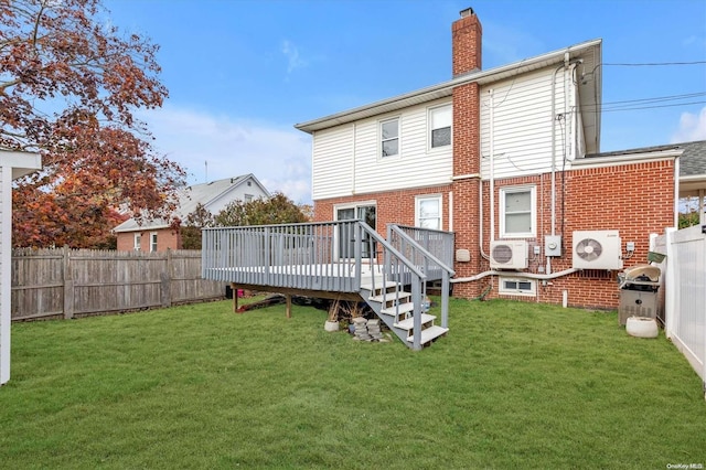 back of house featuring a wooden deck, a yard, and ac unit