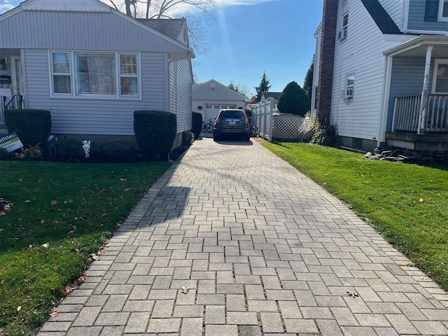 view of side of property with a yard and a garage