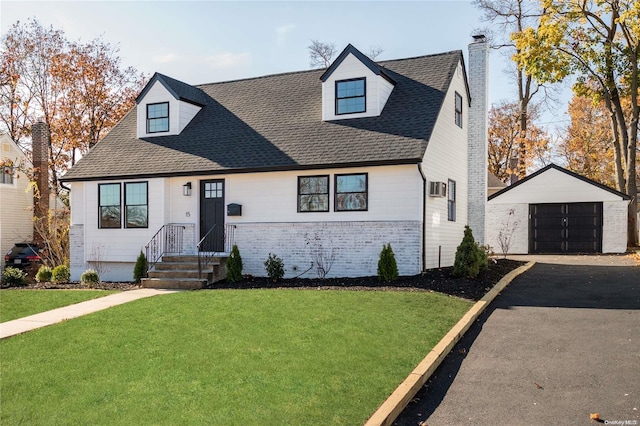 cape cod home with a front lawn, an outdoor structure, and a garage