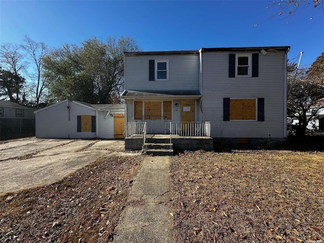 view of property featuring covered porch