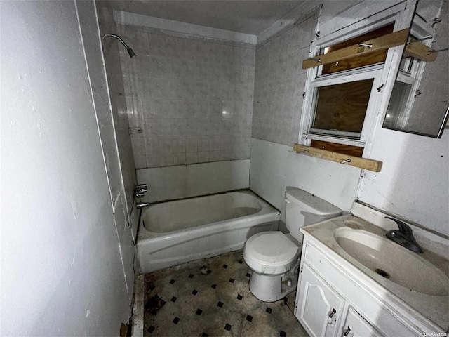 full bathroom with vanity, toilet, and tiled shower / bath