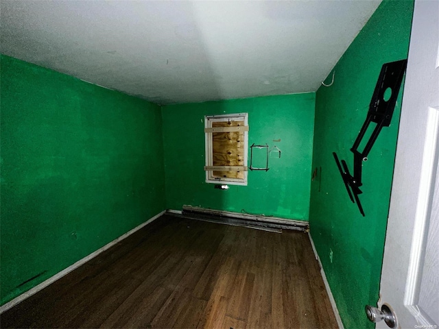 unfurnished room with hardwood / wood-style flooring