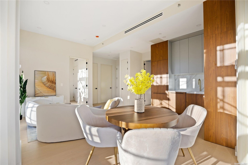 31-16 21st St Unit Ph1A, Astoria, NY 11106 - dining area featuring light wood finished floors