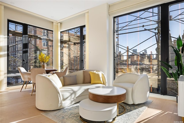 31-16 21st St Unit 3C, Astoria, NY 11106 - living area with wood finished floors, plenty of natural light, and a sunroom