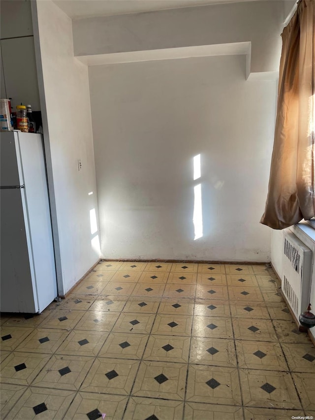 99-40 63rd Rd Unit 5A, Rego Park, NY 11374 - unfurnished room with light flooring and heating unit