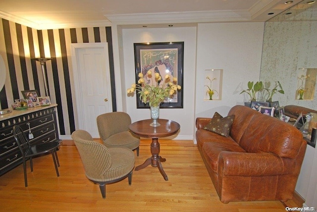 living area featuring light hardwood / wood-style flooring and crown molding