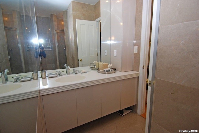 bathroom with vanity, tile patterned floors, and walk in shower