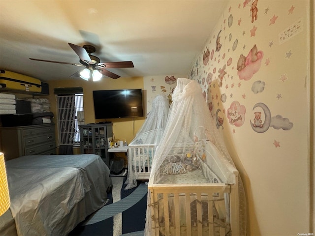 carpeted bedroom featuring ceiling fan