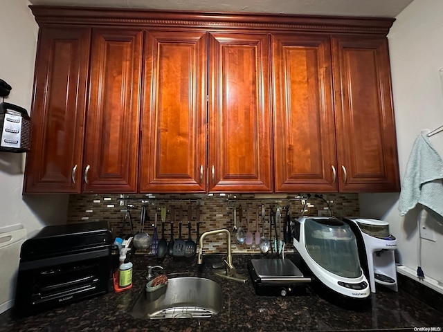 clothes washing area with sink