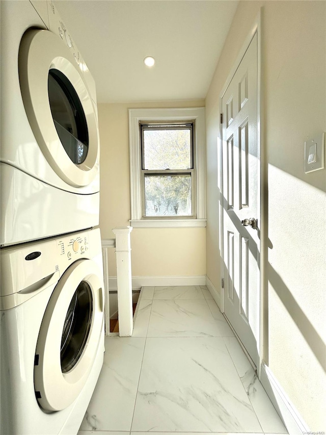 laundry area featuring stacked washer and dryer