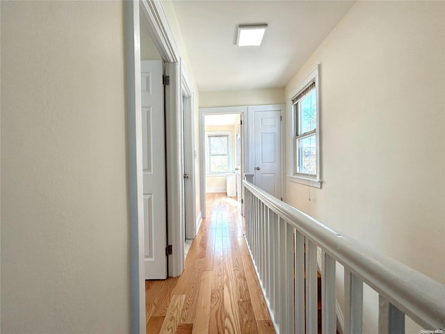 corridor with light wood-type flooring