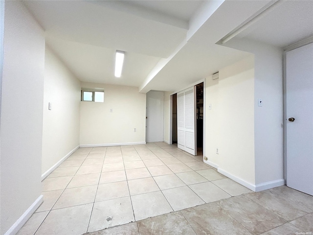 empty room with light tile patterned floors