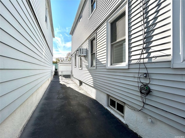 view of side of home with a garage and an outdoor structure