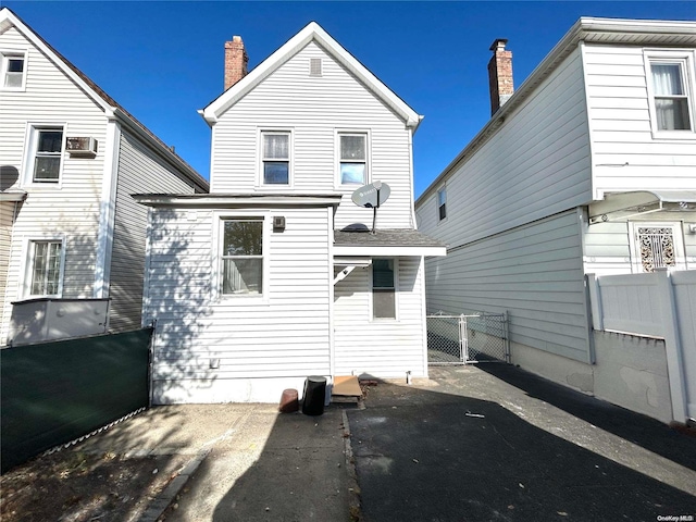 back of house with a patio